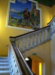 The main staircase of Schloss Ringberg. The painting, by Attenhuber, depicts himself and Duke Leitpold. Credit: ACerS.