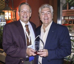 Curt Zimmer (left) presents Eric Young (right) with the 2012 Bill Bates Award.