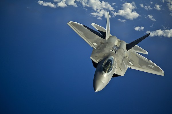 A U.S. Air Force F-22 Raptor aircraft from the 199th Fighter Squadron, Hawaii Air National Guard returns to a training mission after taking on fuel from a KC-135 Stratotanker aircraft from the 96th Air Refueling Squadron March 27, 2012, over the Pacific Ocean near the Hawaiian Islands. During this mission, Air Force Academy cadets received a familiarization flight to get a better understanding of the Air Force's global reach capabilities. (U.S. Air Force photo by Tech. Sgt. Michael Holzworth/Released)