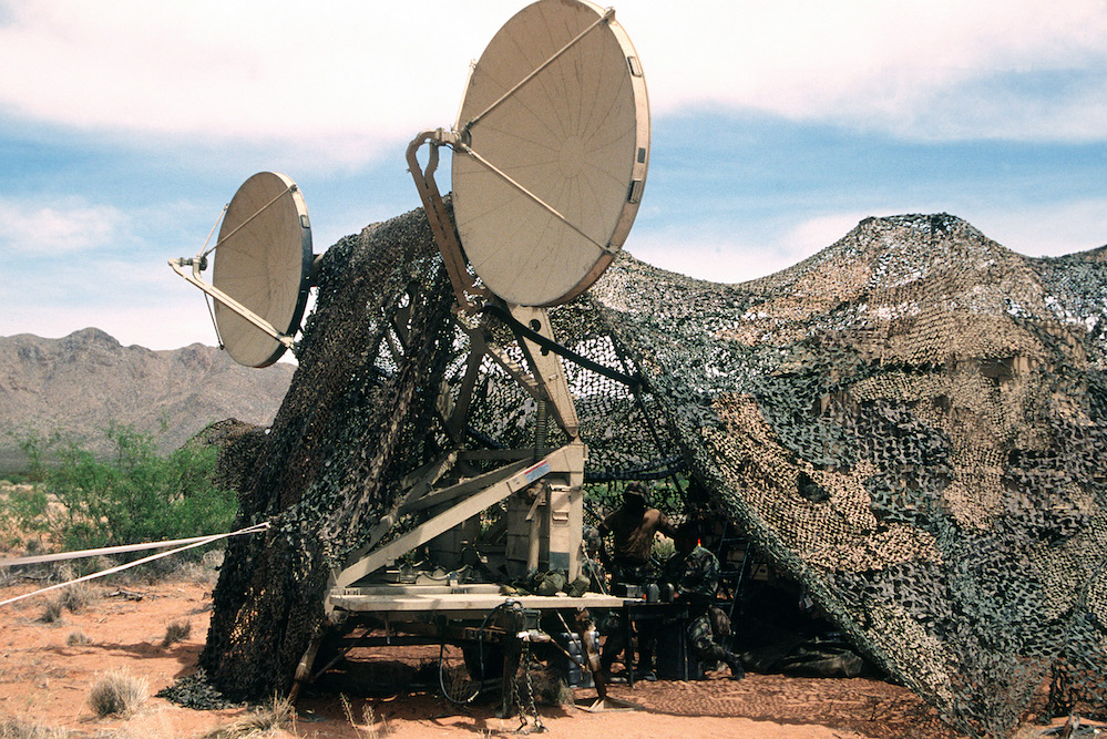 A close-up view of dual 9 1/2' tropo scatter microwave dishes.  They are the quick reaction antenna for the TRC-170 Triple Scatter Microwave System that sends data to the Air Operations Center and Joint Forces Air Command.