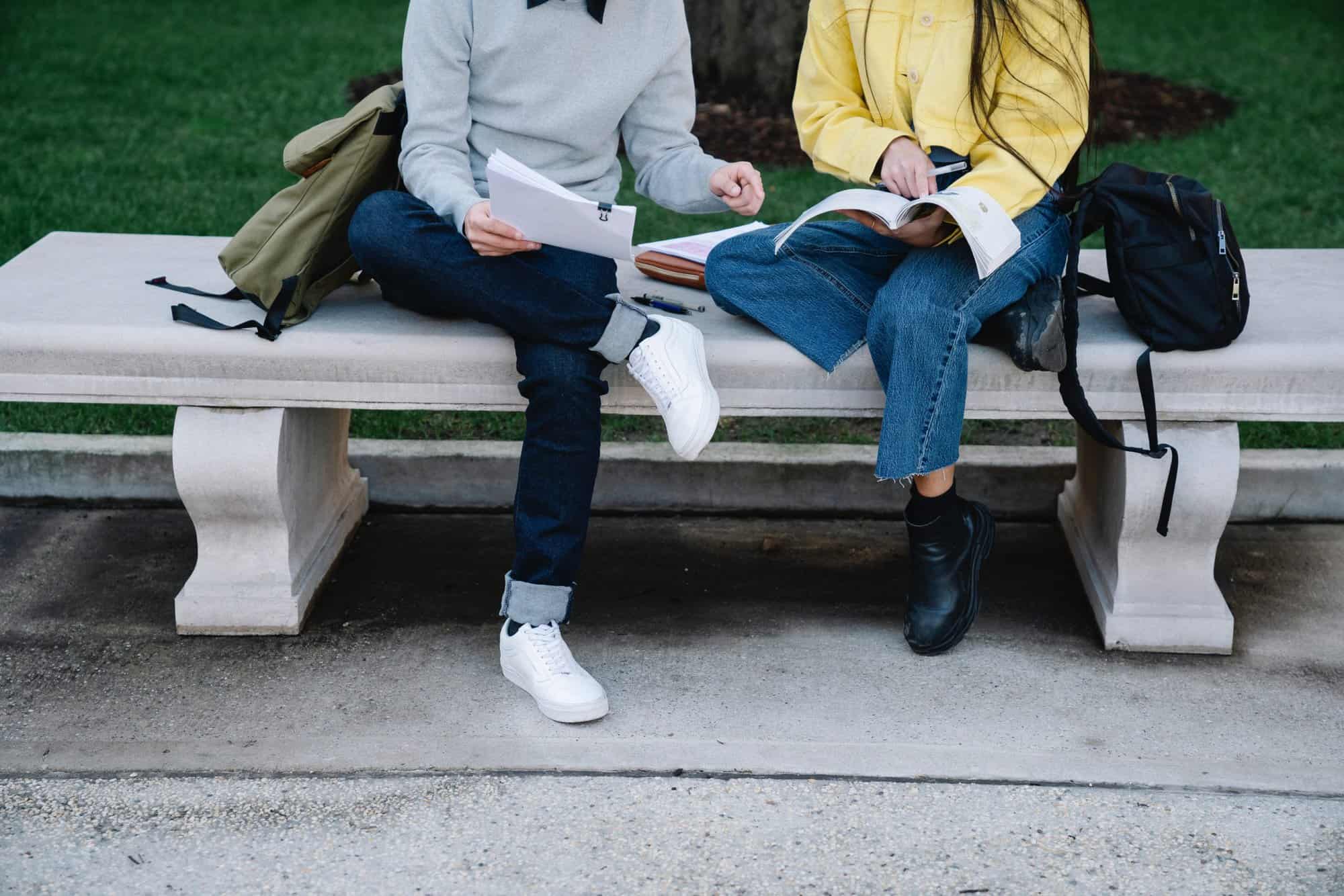 resources for students pair studying on a bench