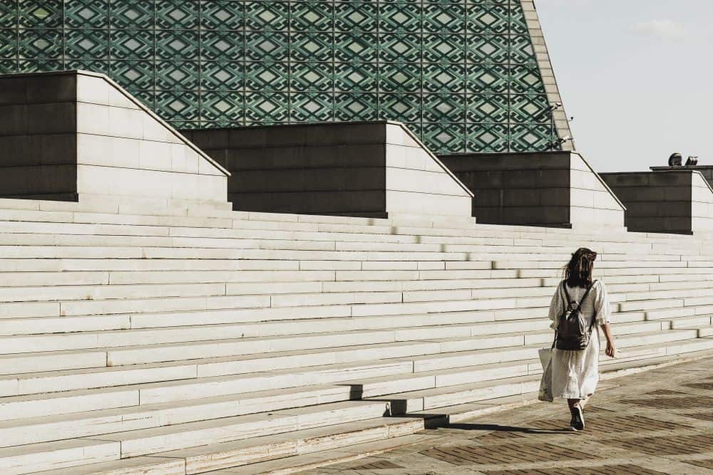 07-14 woman walking concrete steps