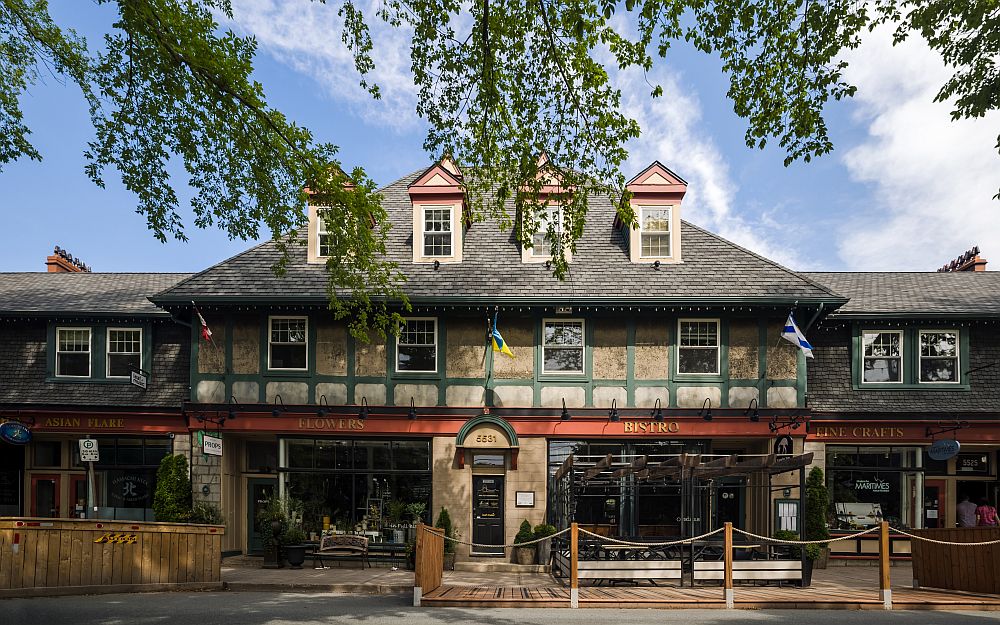 Row of shops in Halifax with dormer windows and flags, rebuilt after the Halifax Explosion.