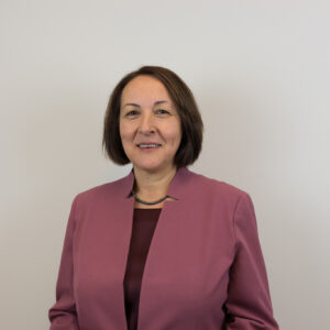 Candan Tamerler in a professional headshot wearing a mauve blazer.